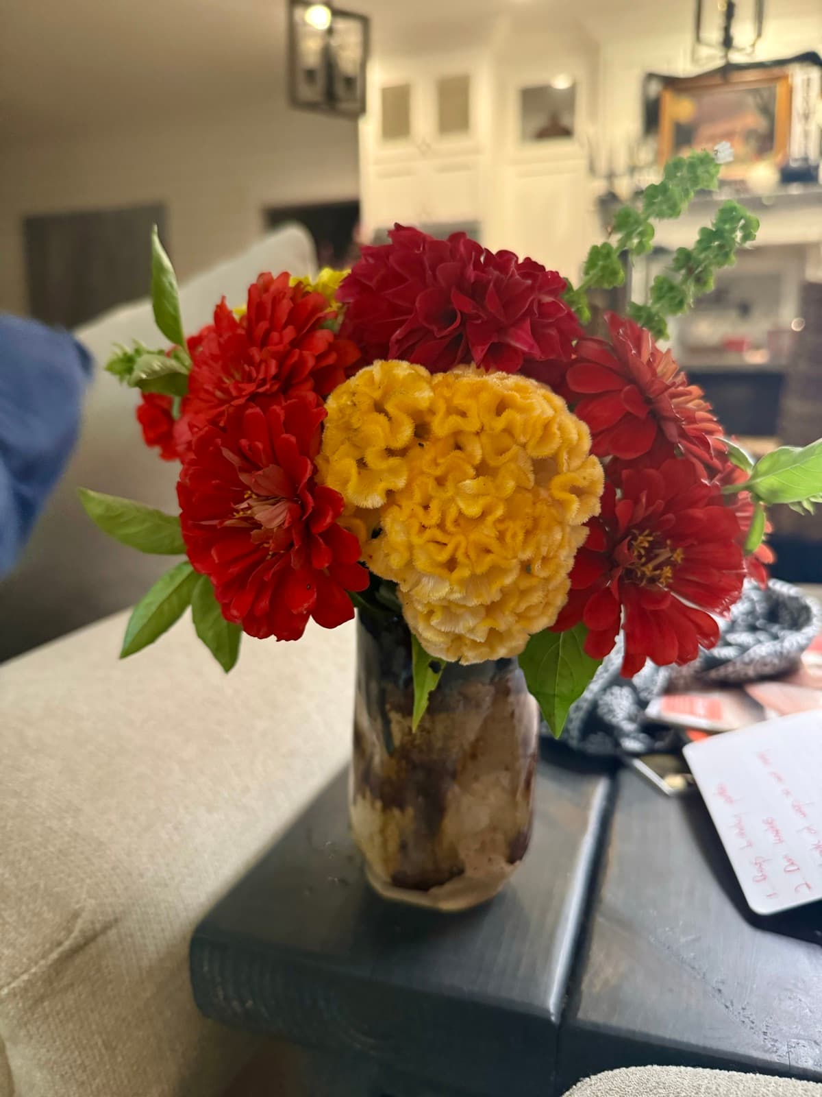 Beautiful bouquet of flowers on a coffee table at home