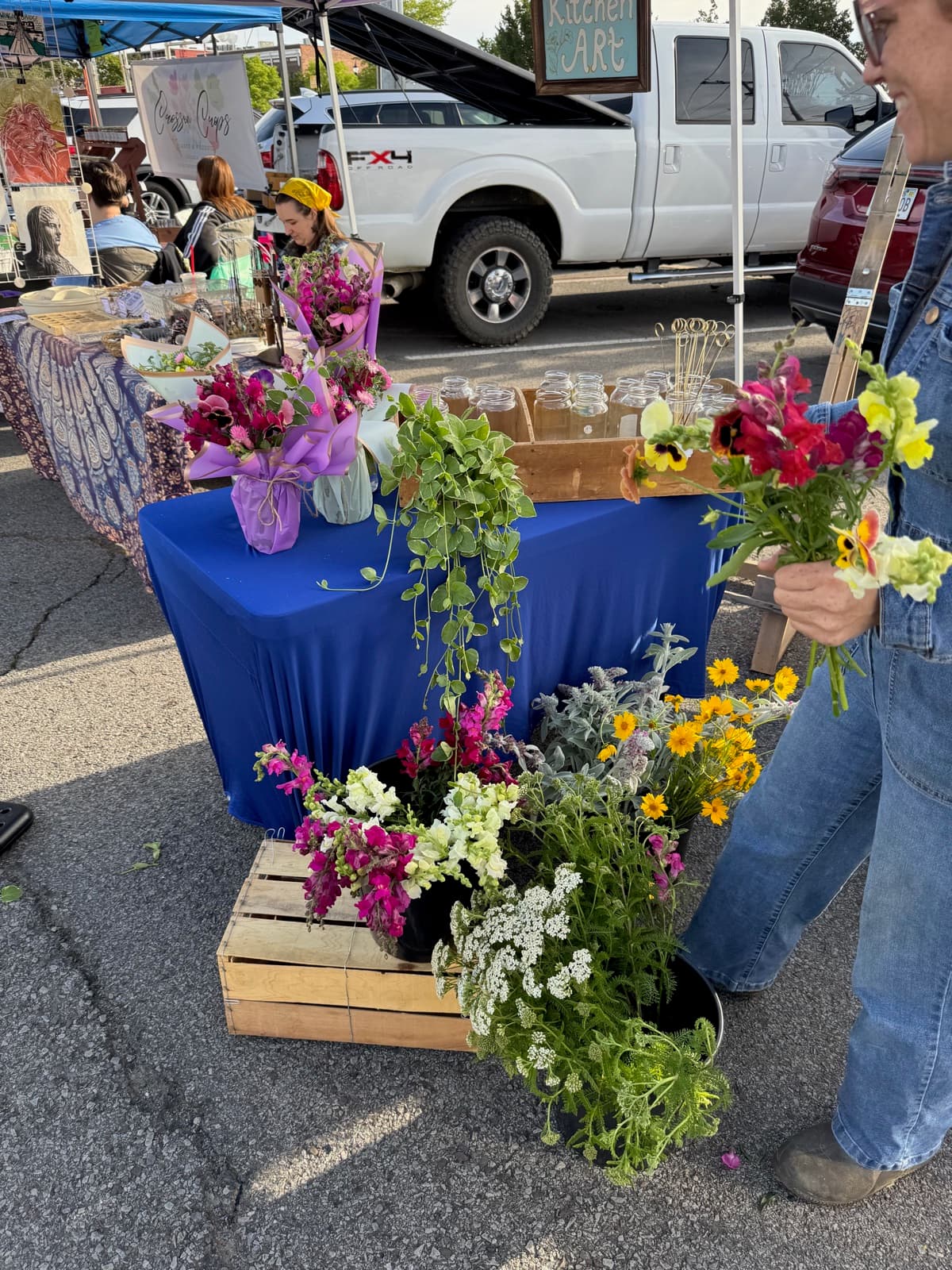 Colorful flowers displayed at the market booth